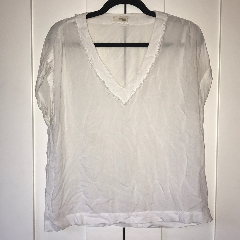 White v-neck blouse with frayed neckline